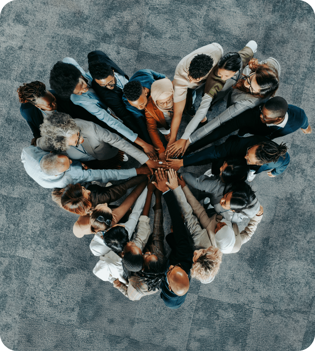 A group of people standing in the shape of a heart.